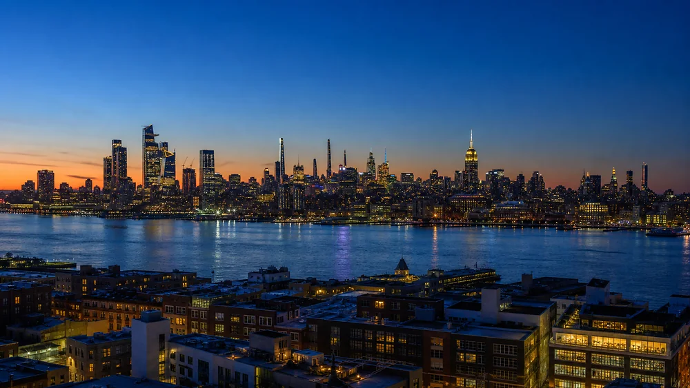 Midtown Manhattan at dusk seen across the Hudson from Palisades Avenue